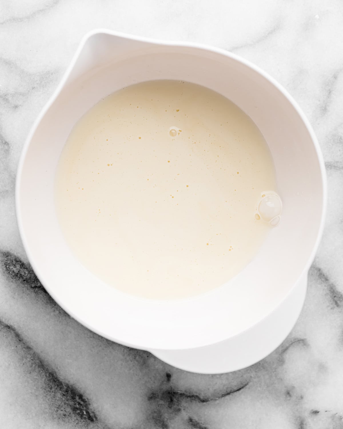 whipping cream in a bowl before being whipped