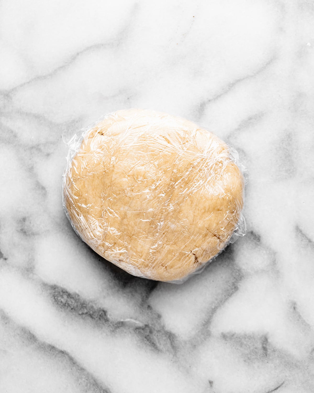 how to make French silk pie crust - shaping into a disc & wrapping in plastic wrap