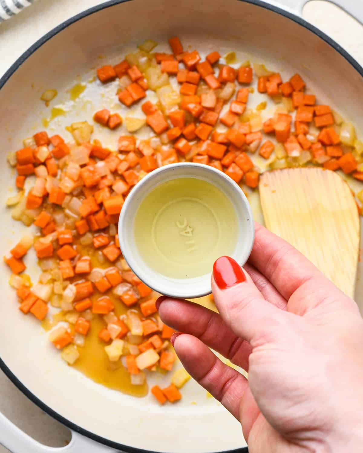 How to Make Fried Rice - adding mirin to cooked carrot mixture