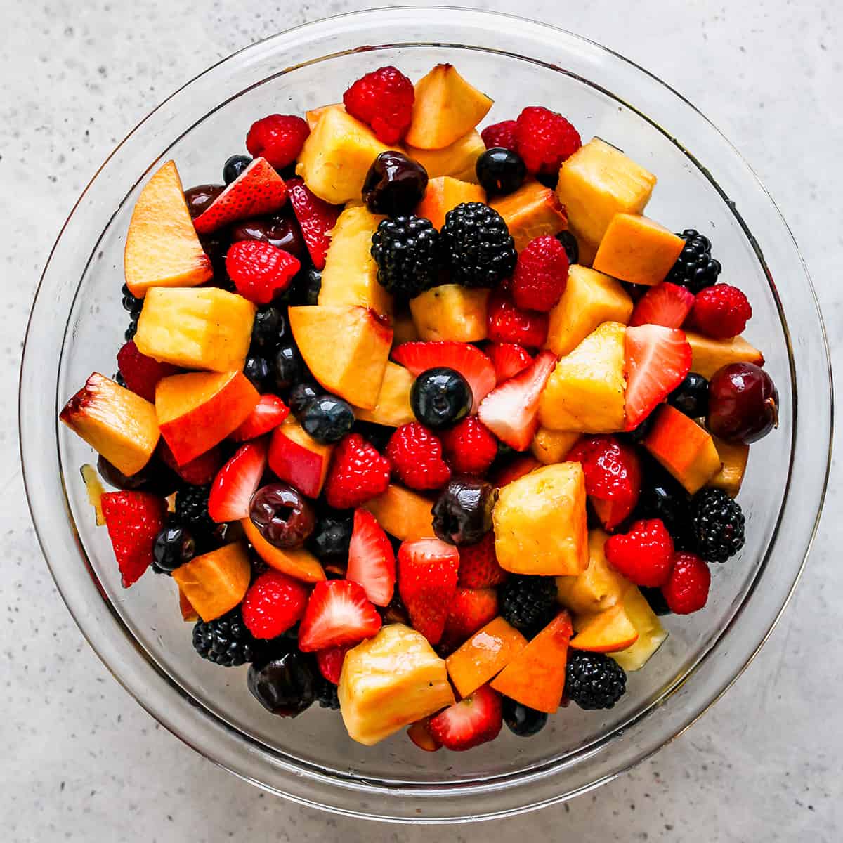 How to Make Fruit Salad - stirred salad ready to be chilled
