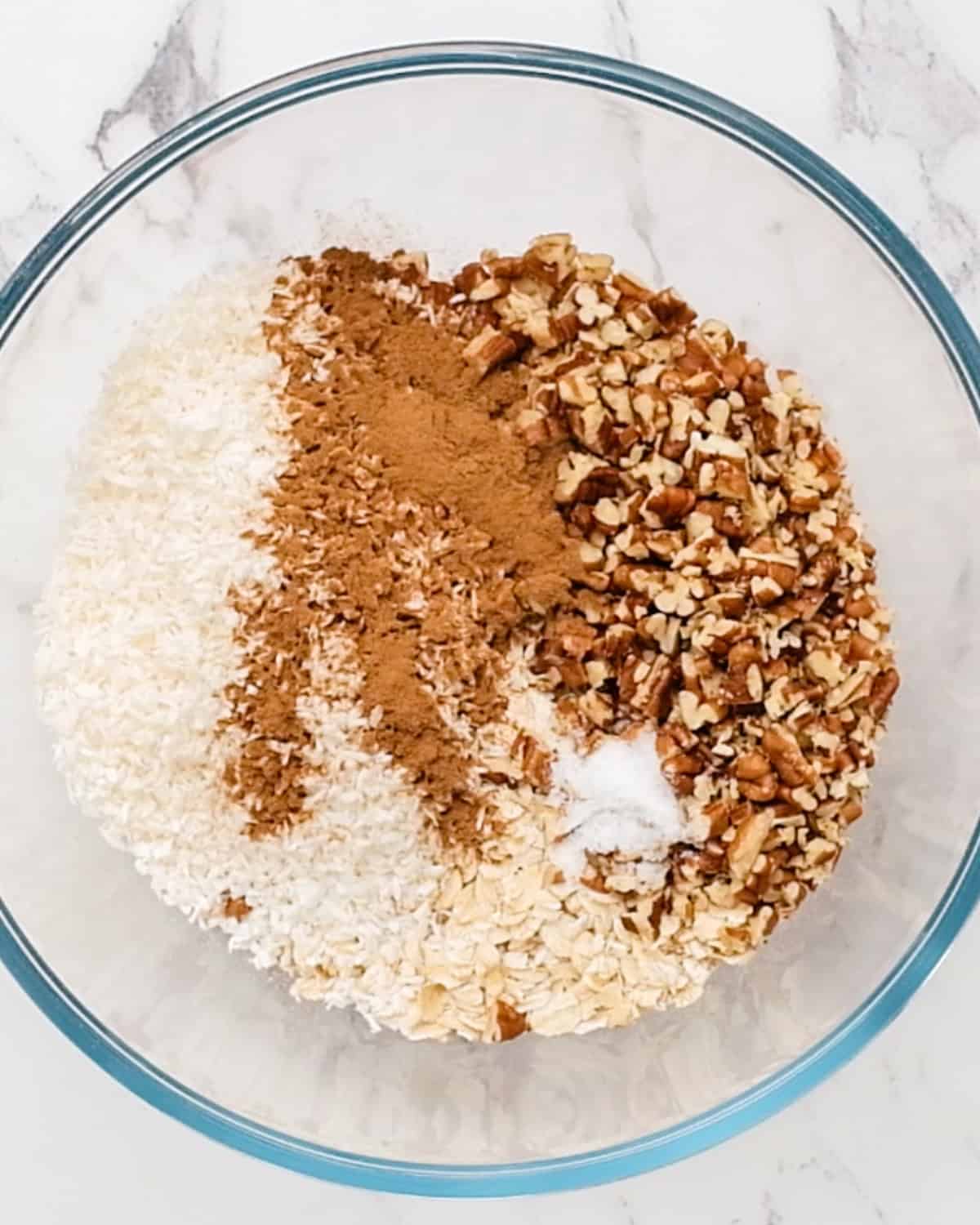 How to Make Homemade Granola - dry ingredients in a bowl before mixing