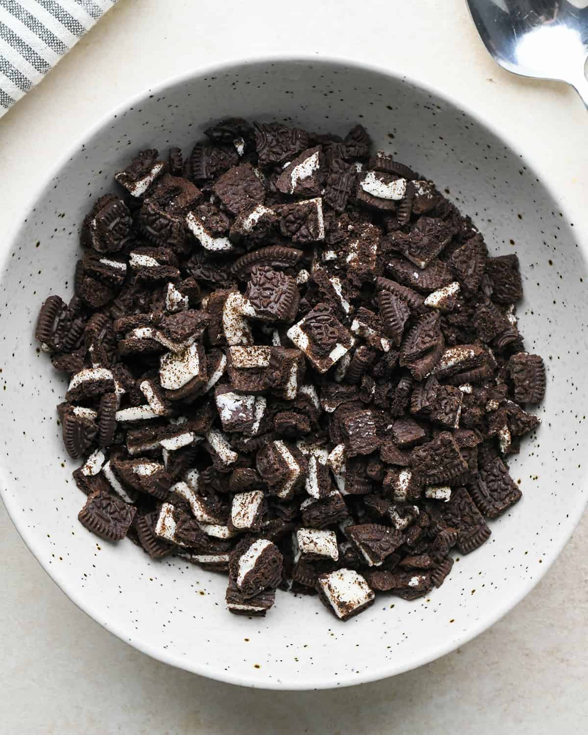 assembling an ice cream cake - chopped oreos in a bowl