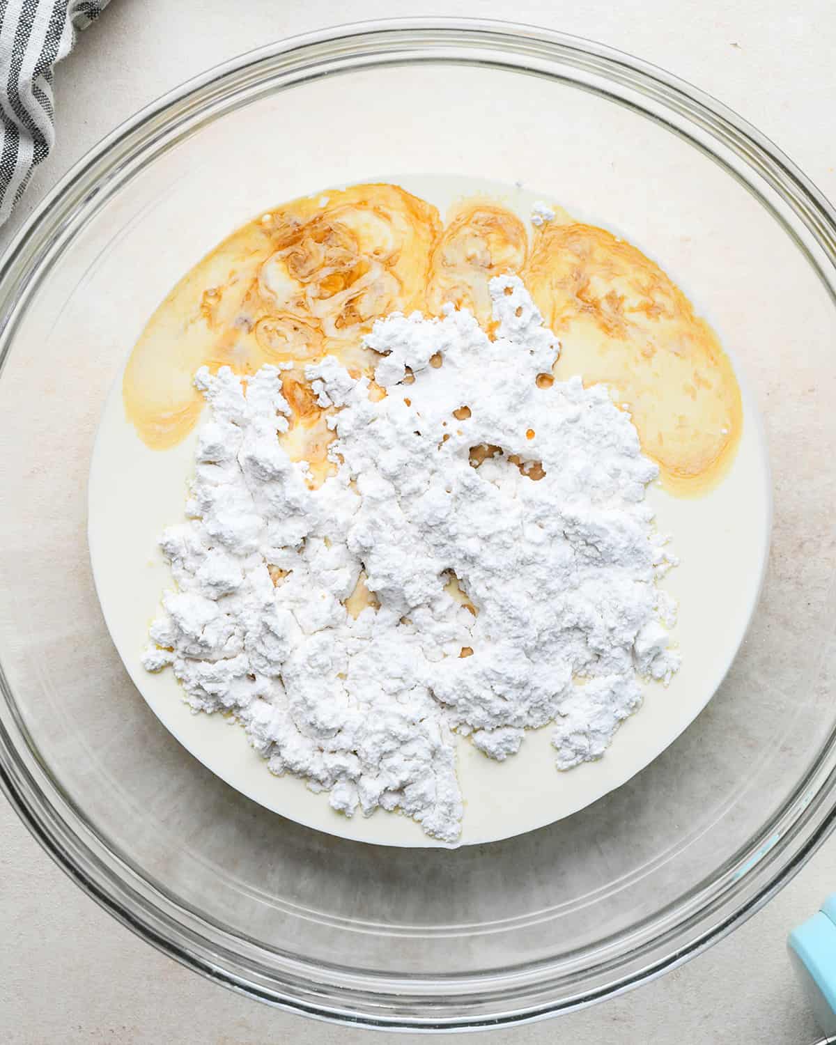 How to Make an Ice Cream Cake - whipped cream ingredients in a bowl before whipping