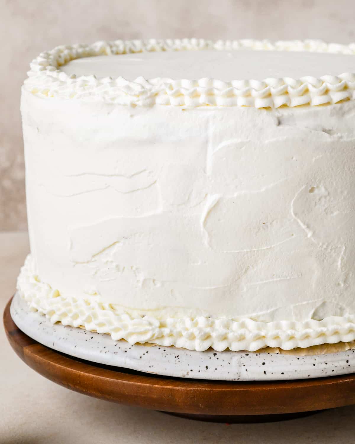 final frosted ice cream cake on a cake stand