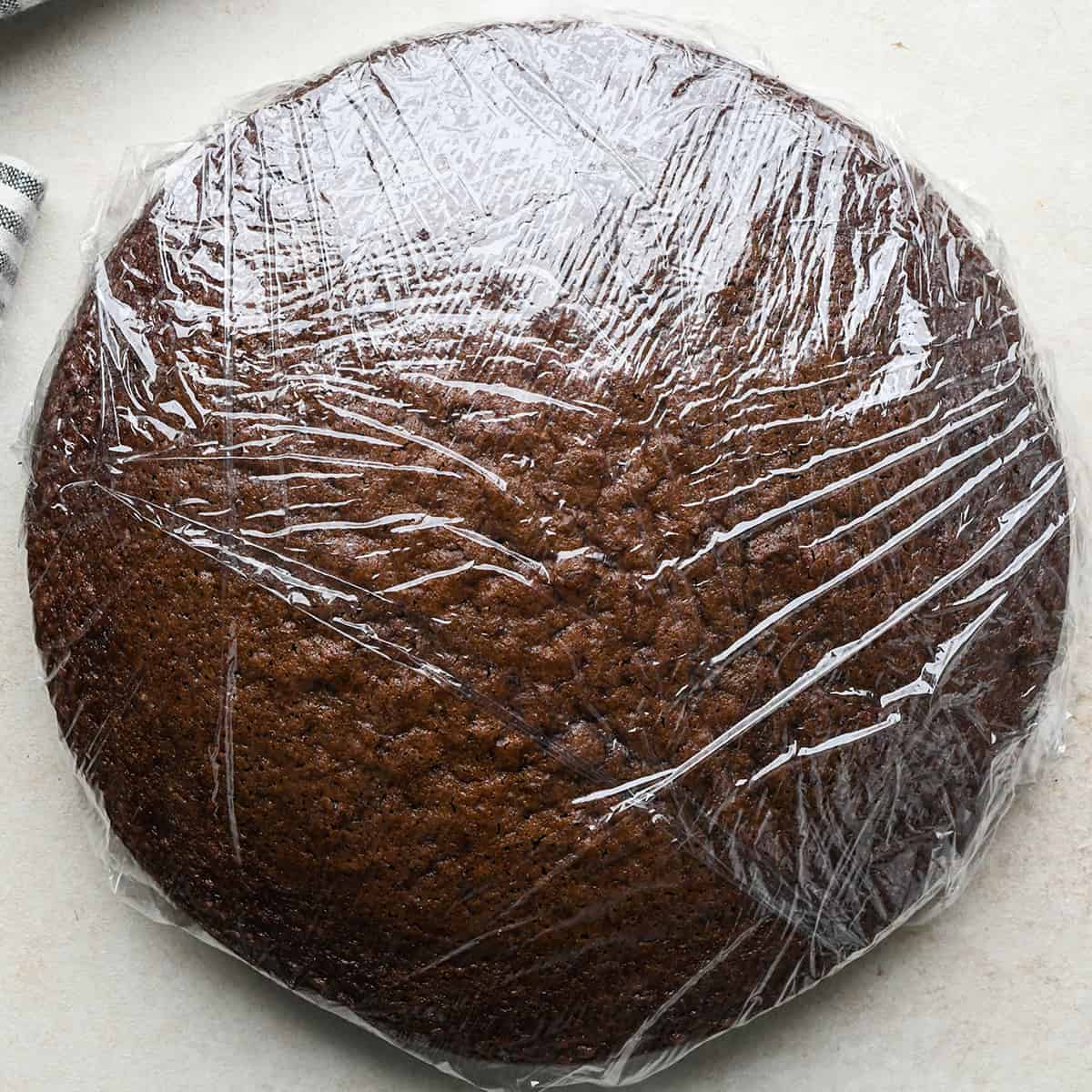 How to Make an Ice Cream Cake - chocolate cake wrapped in plastic wrap to be frozen