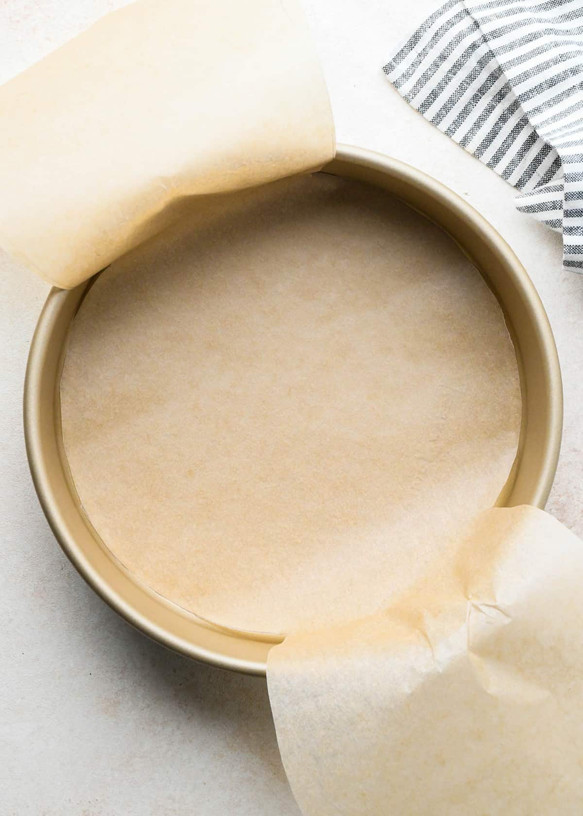 a cake pan lined with parchment paper