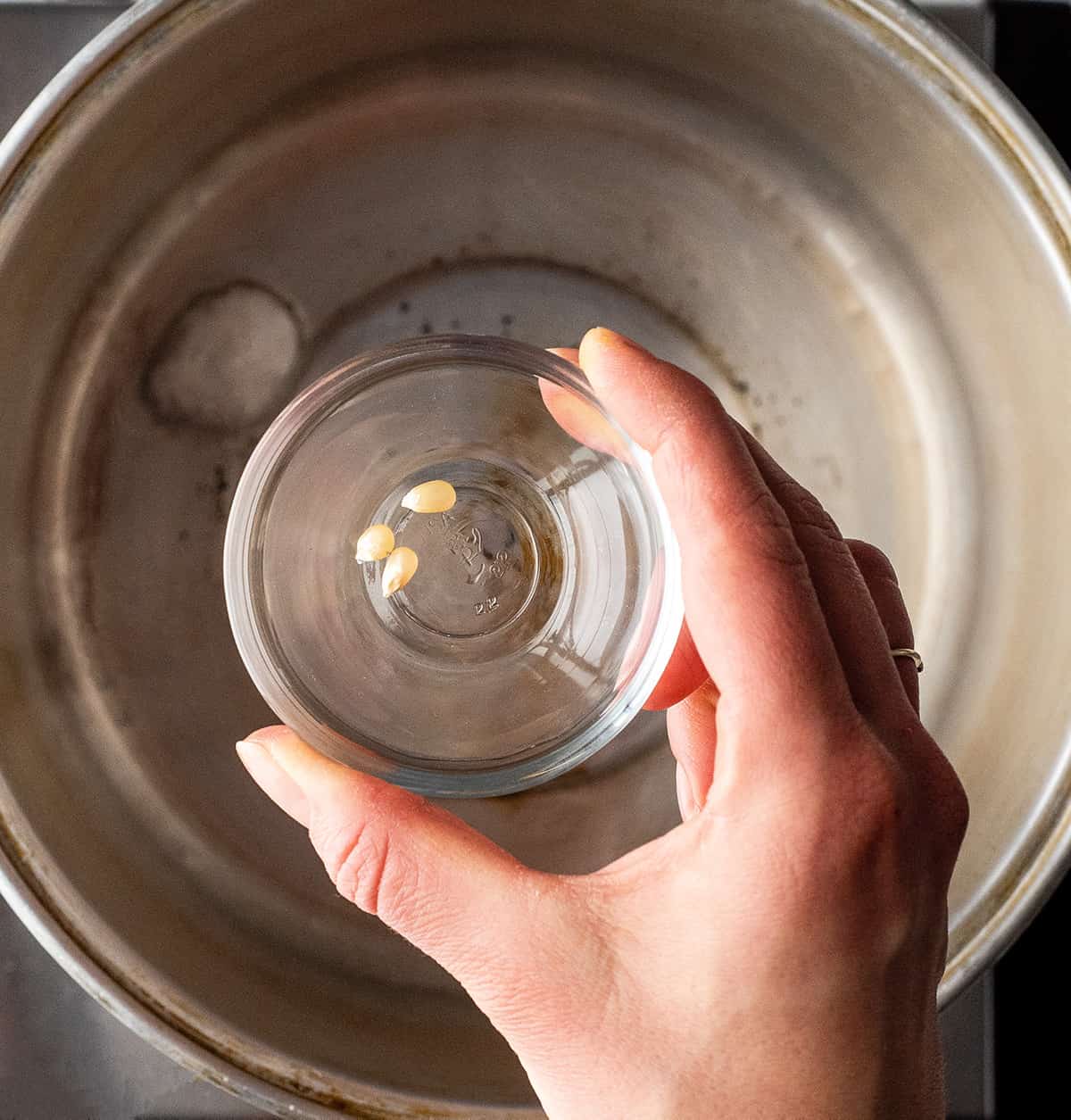 This easy homemade Kettle Corn Recipe is made with 4 ingredients, in less than 5 minutes on the stovetop. Better than the kettle corn at the fair! It's gluten-free and dairy-free! overhead photo showing how to make kettle corn