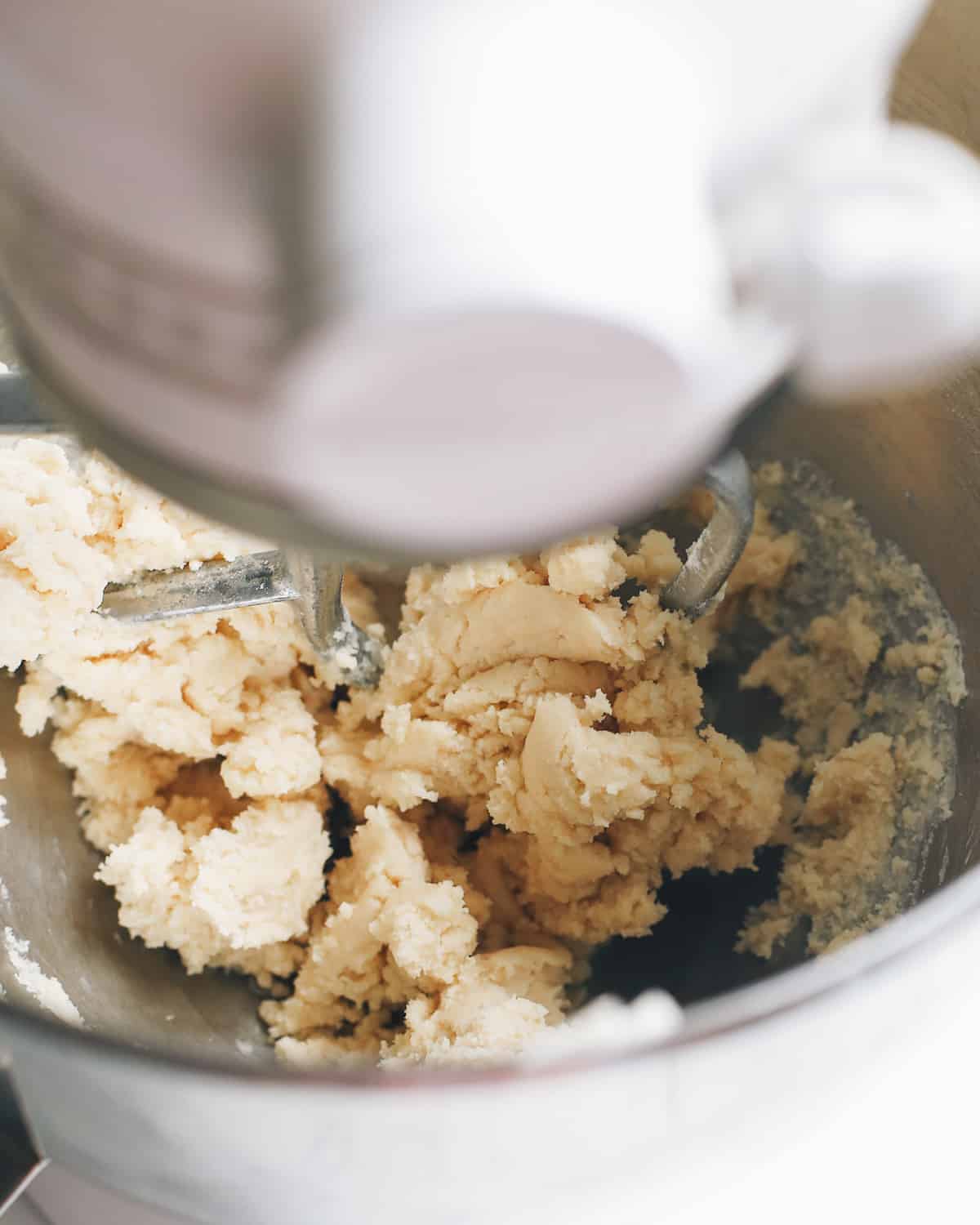 The best lemon bars! A smooth & sweet lemon filling sits on top of a buttery shortbread crust for the most delicious lemon squares recipe. Plus these easy lemon bars are simple to make with only 8 ingredients! How to Make Lemon Bars - making the shortbread crust