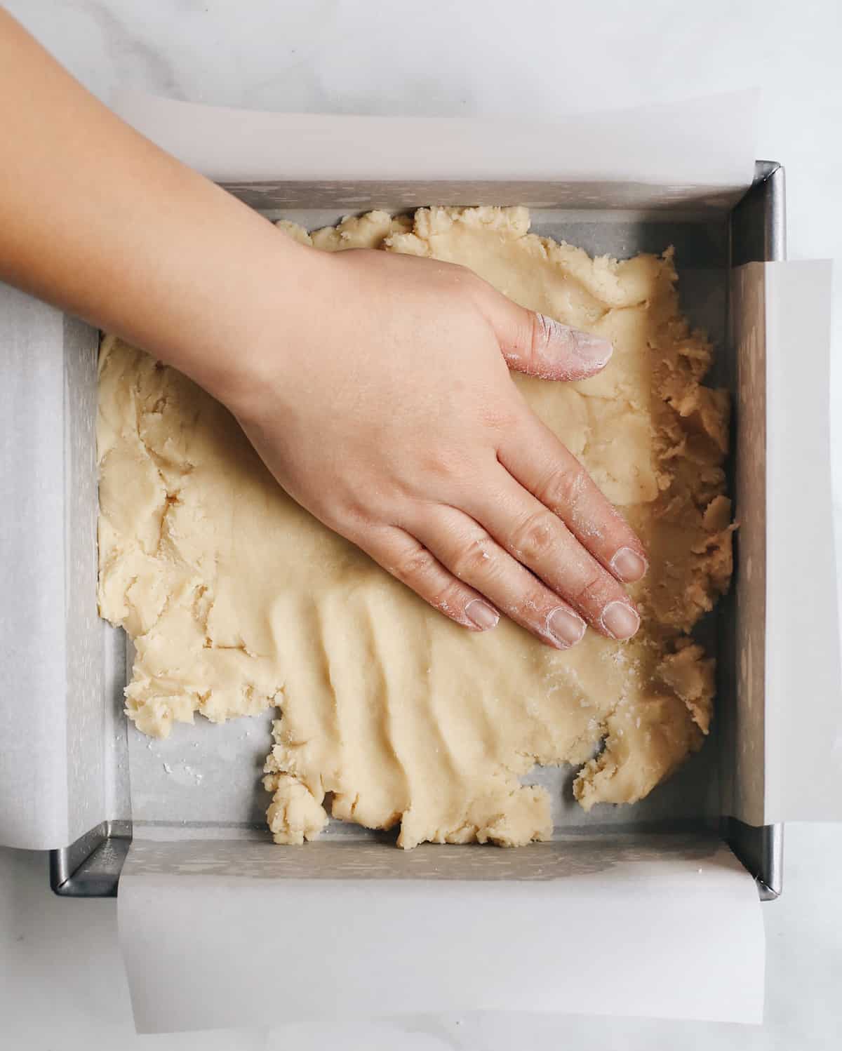 How to Make Lemon Bars forming the crust in the baking pan