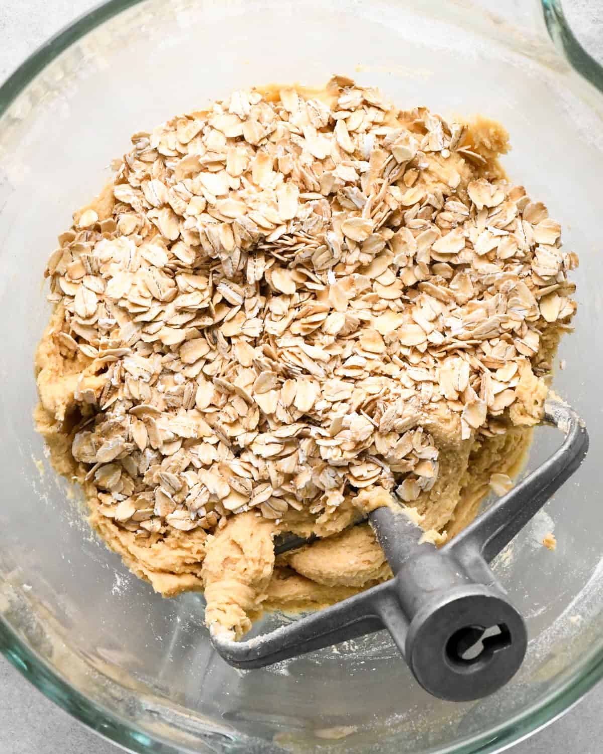 oatmeal added to the oatmeal cookie dough in a mixer with the paddle attachement