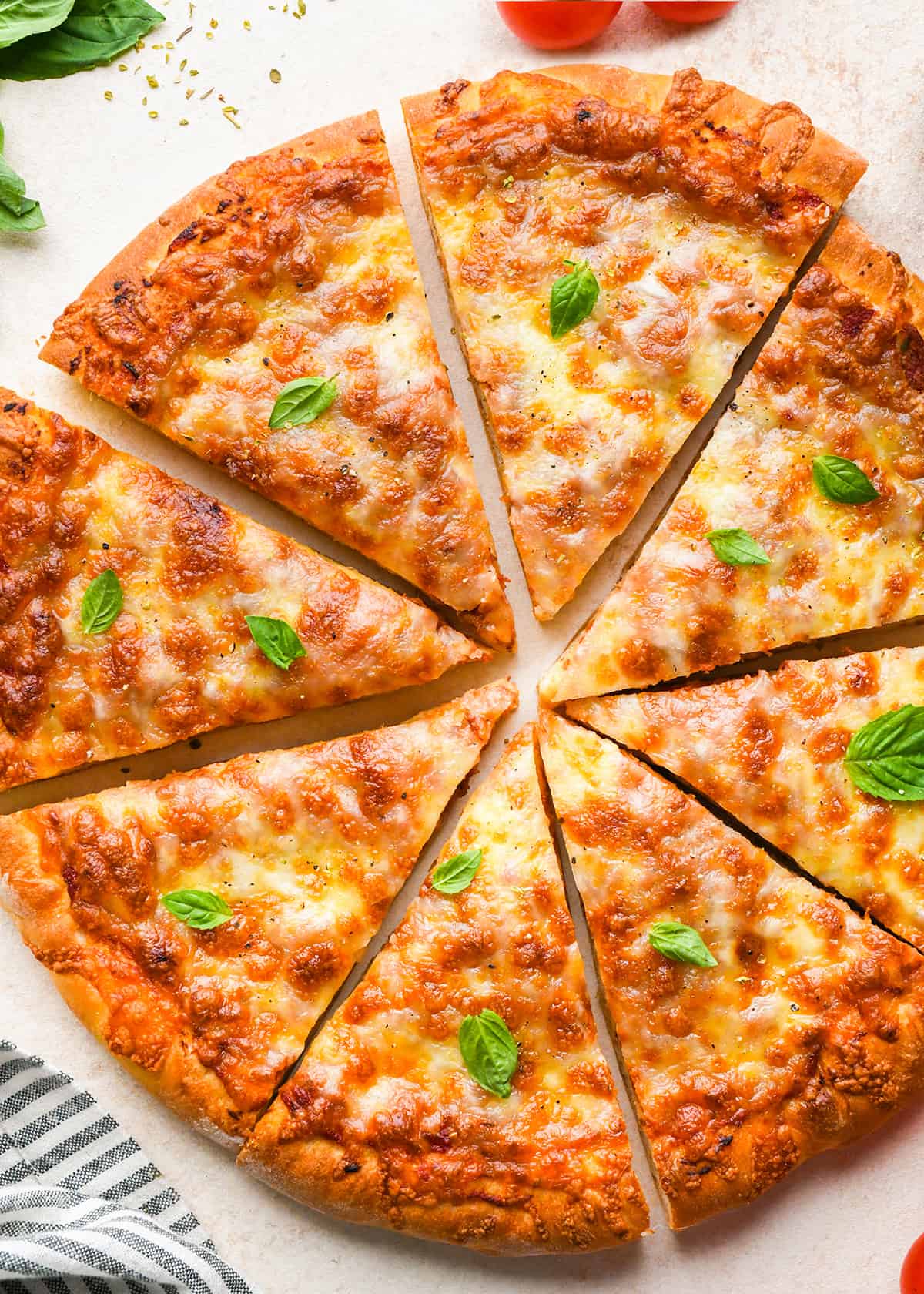 a homemade pizza cut into 8 triangular pieces