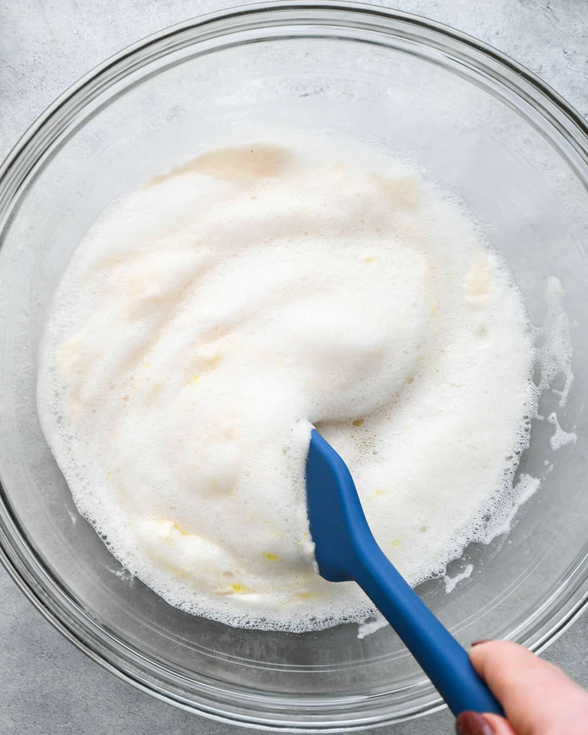 How to Make Pizza adding wet ingredients to dough