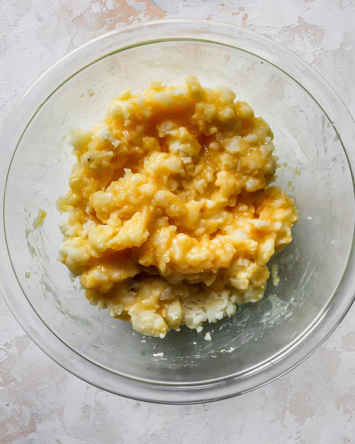 How To Make Potato Pancakes - wet ingredients added to riced potatoes after mixing