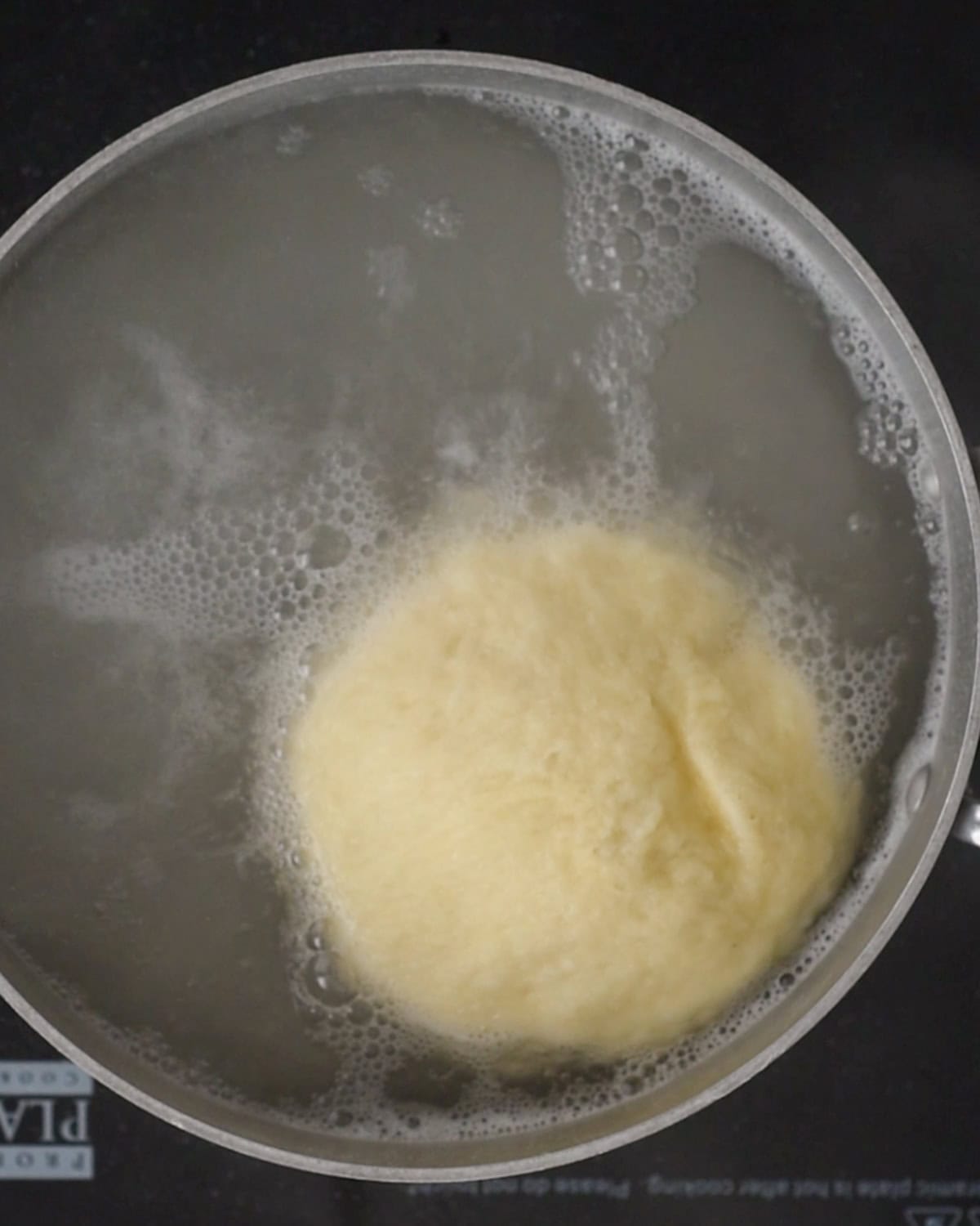 How to Make Pretzel Bread - dough boiling in a baking soda water bath