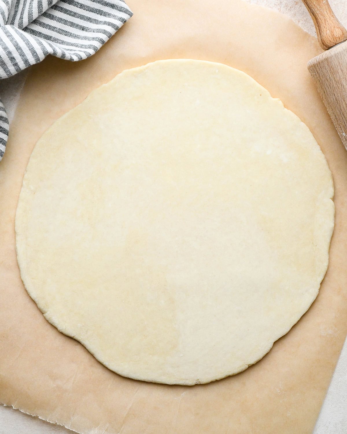 quiche crust rolled out into a circle