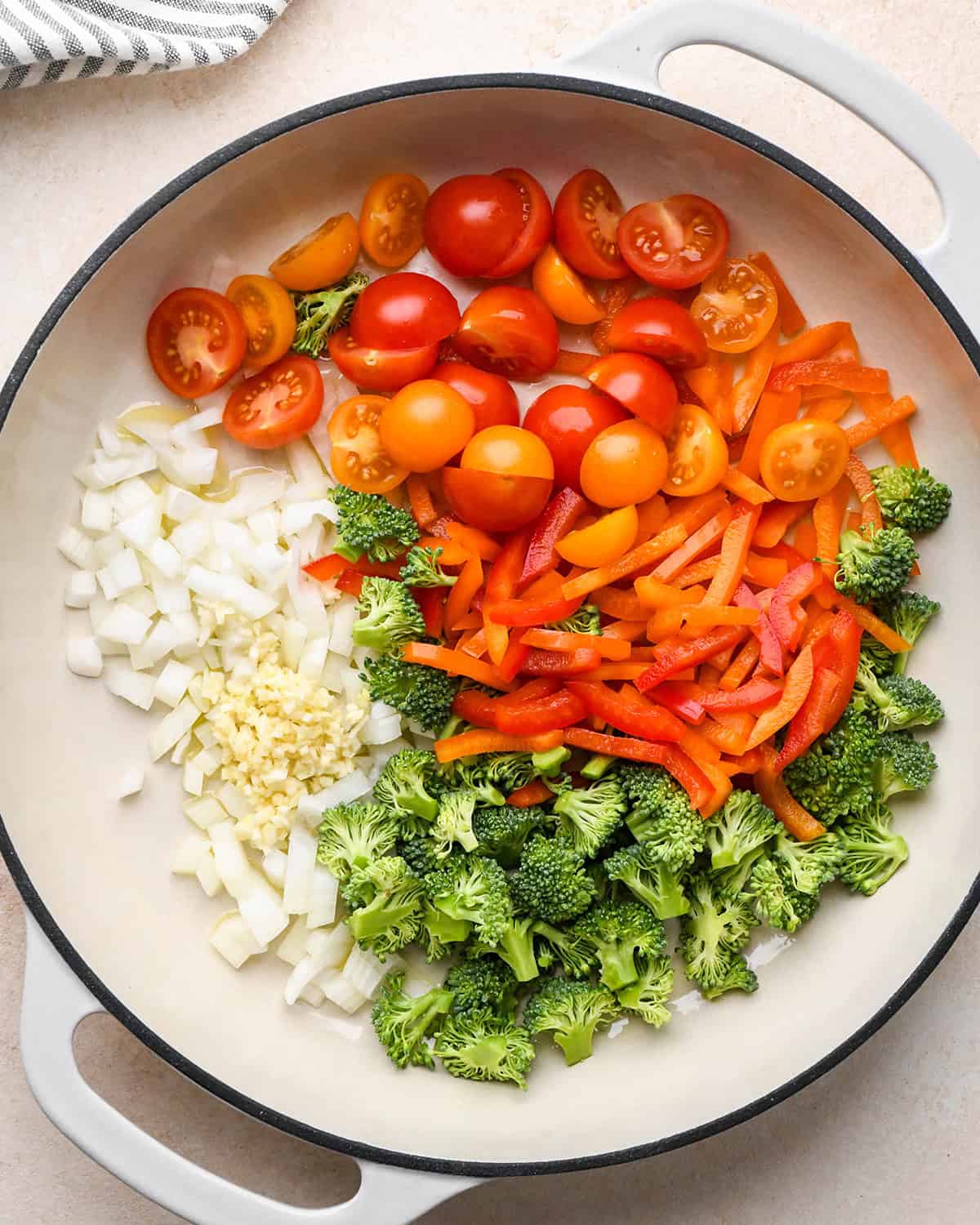 vegetables in a pan before cooking to make vegetable quiche