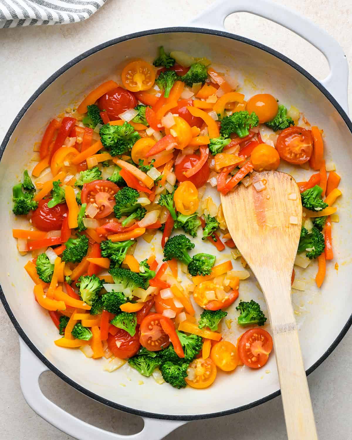 vegetables in a pan after cooking to make vegetable quiche