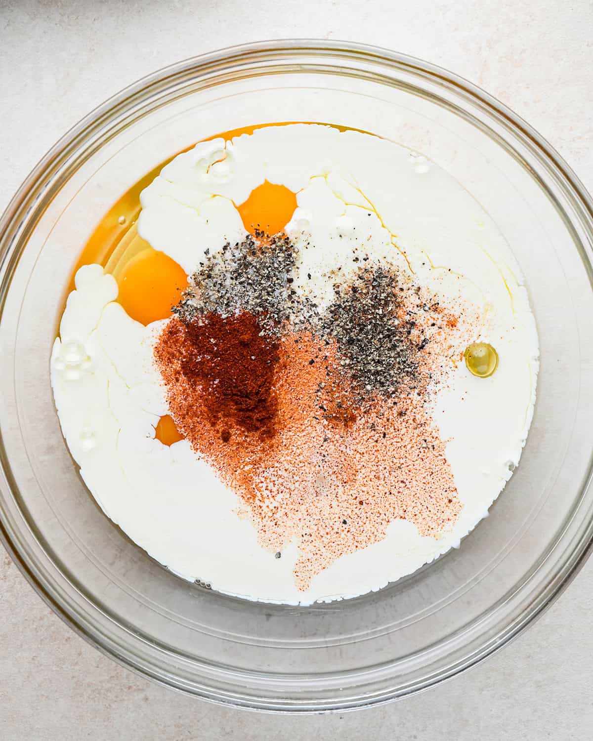 how to make quiche - filling ingredients in a bowl before whisking