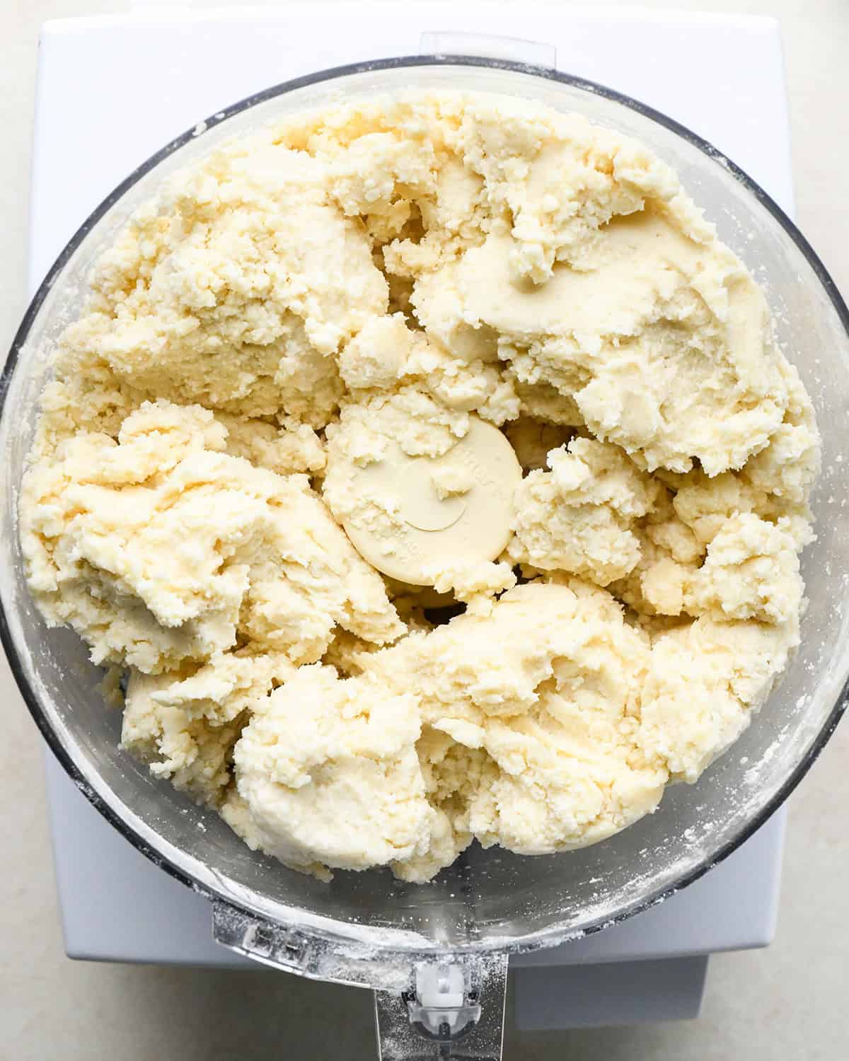 finished quiche crust dough in a food processor