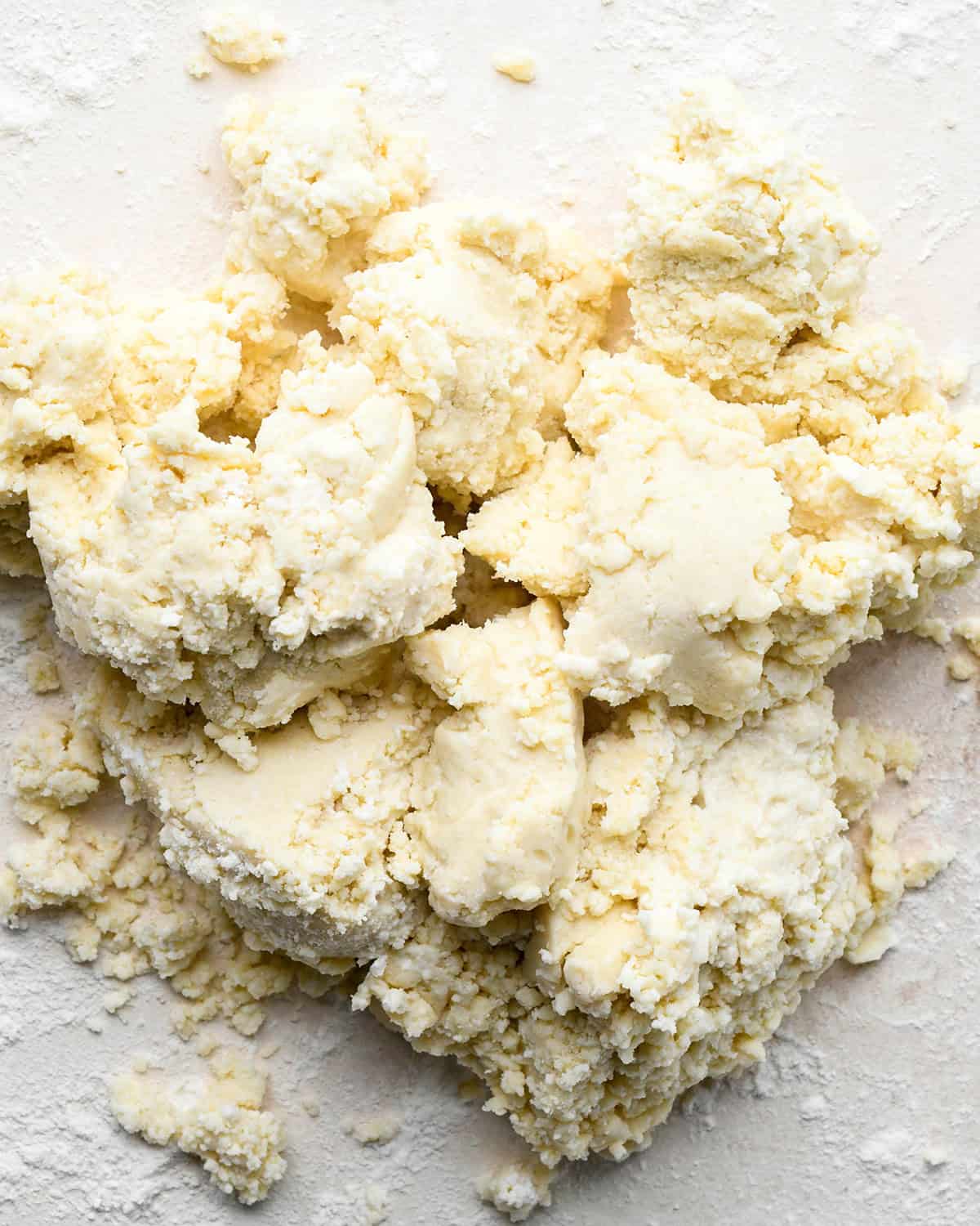 finished quiche crust dough on a floured surface