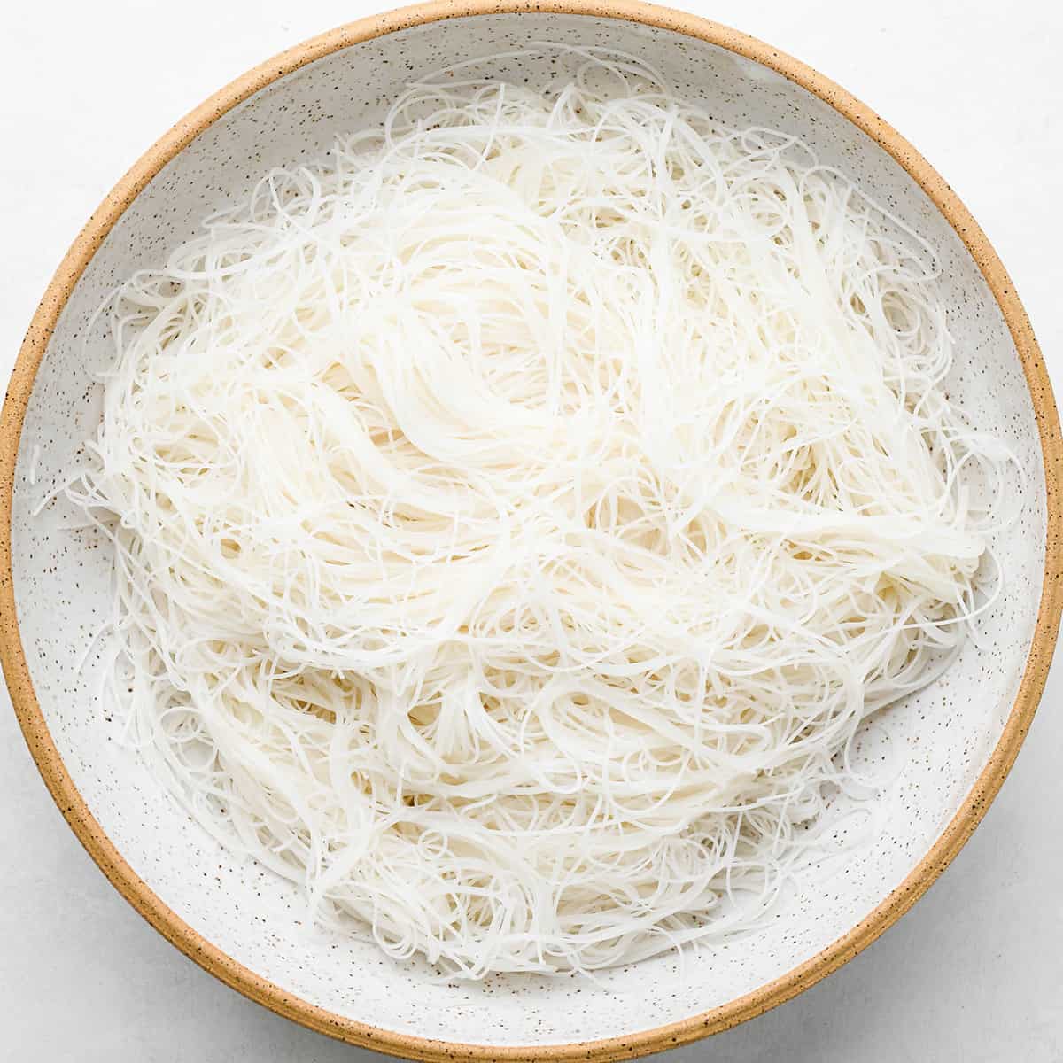 a bowl of brown rice noodles cooked