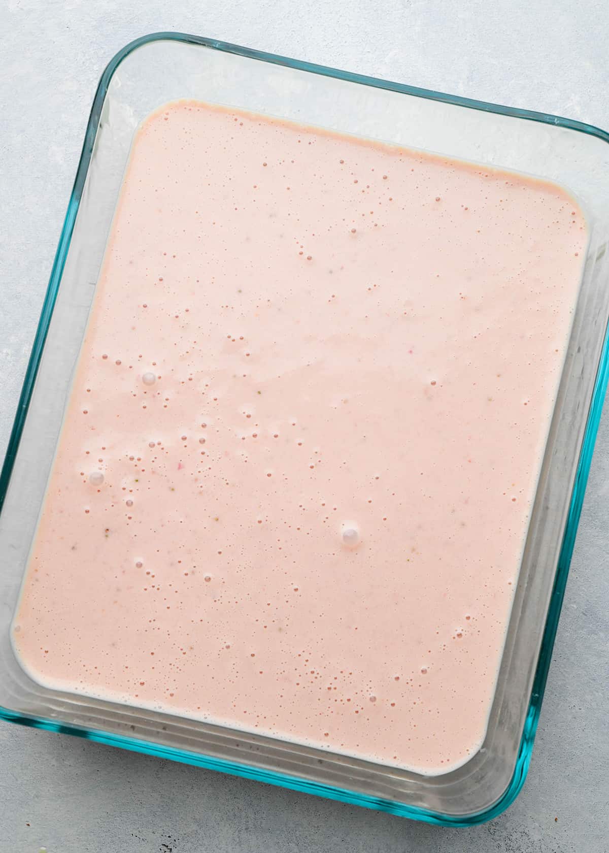 strawberry ice cream mixture in a glass container