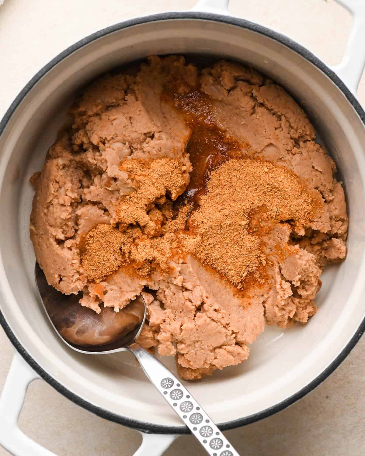 Recipe for Taco Bowls - refried beans ingredients in a pot before mixing