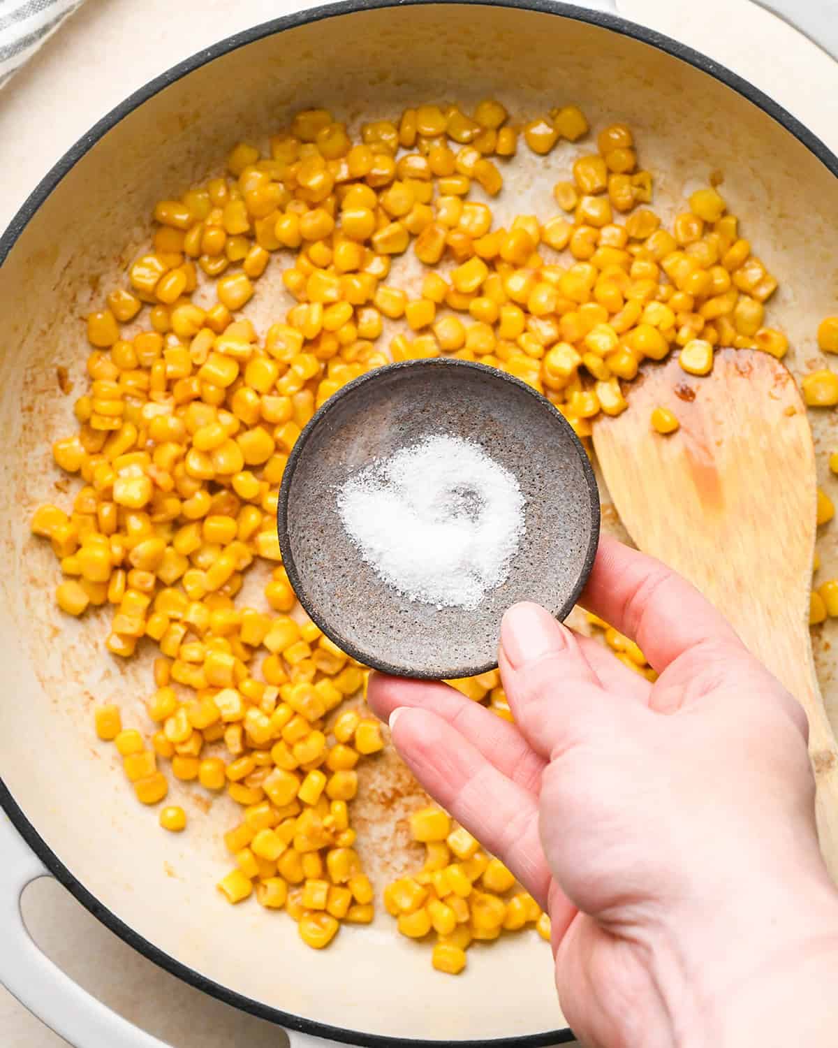 Recipe for Taco Bowls - adding salt to browned corn