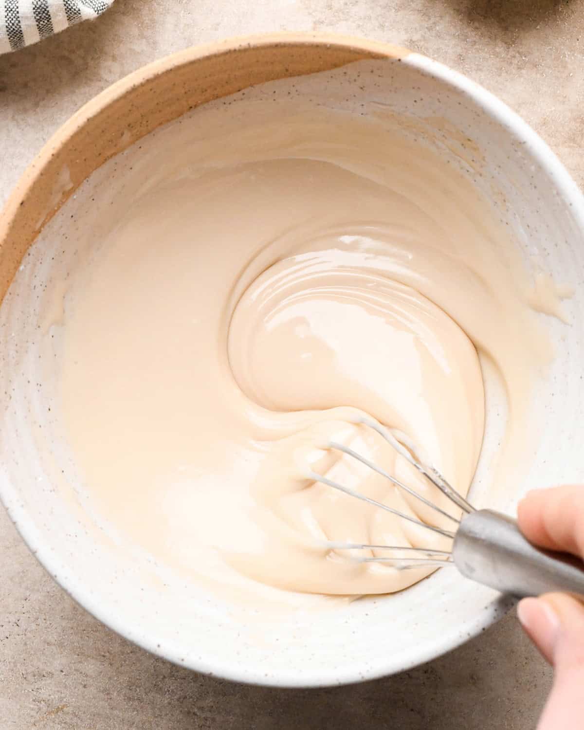Vanilla Icing in a bowl being whisked
