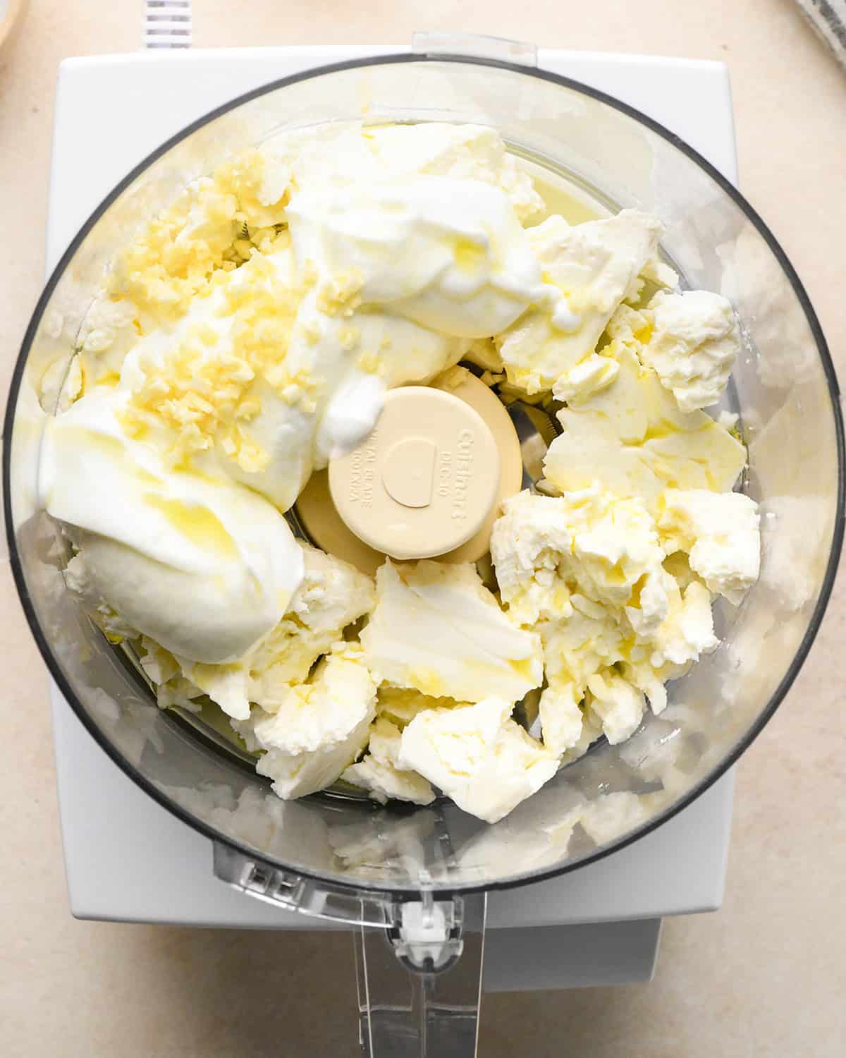 how to make whipped feta - ingredients in a food processor before processing