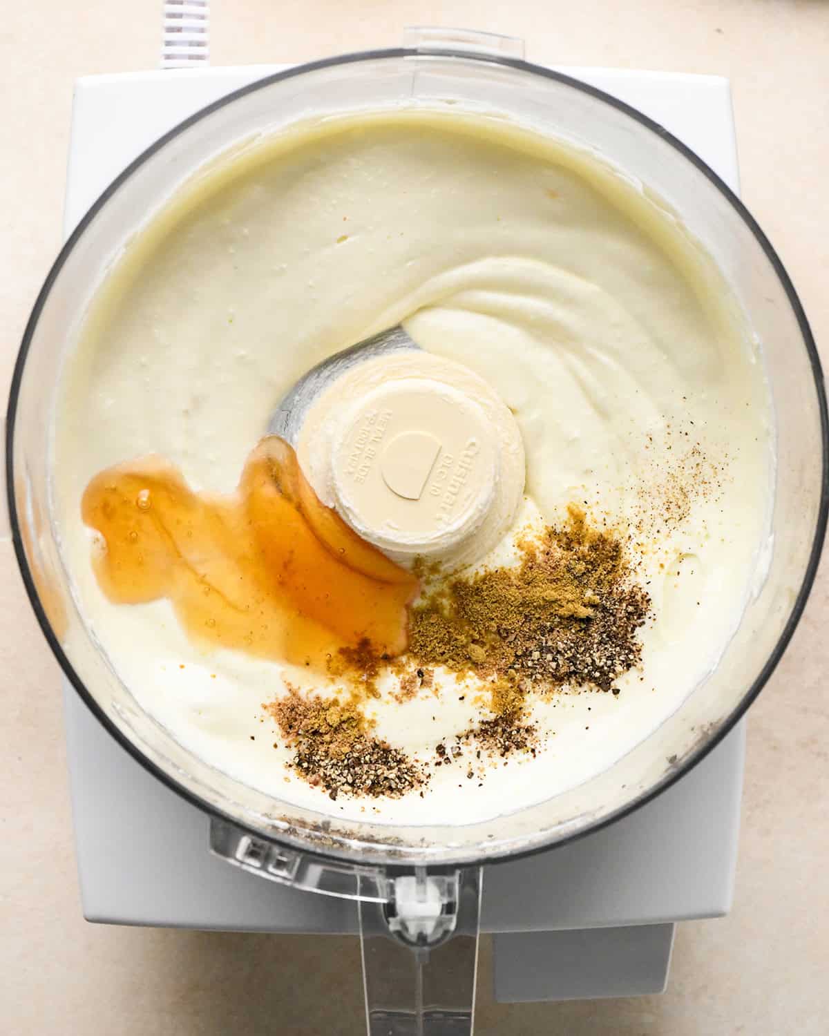 how to make whipped feta - adding spices and honey to the whipped feta