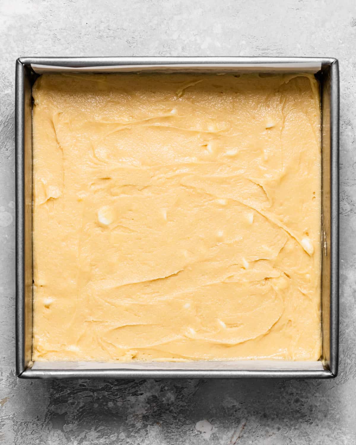 how to make White Chocolate Brownies - batter in a baking pan before baking