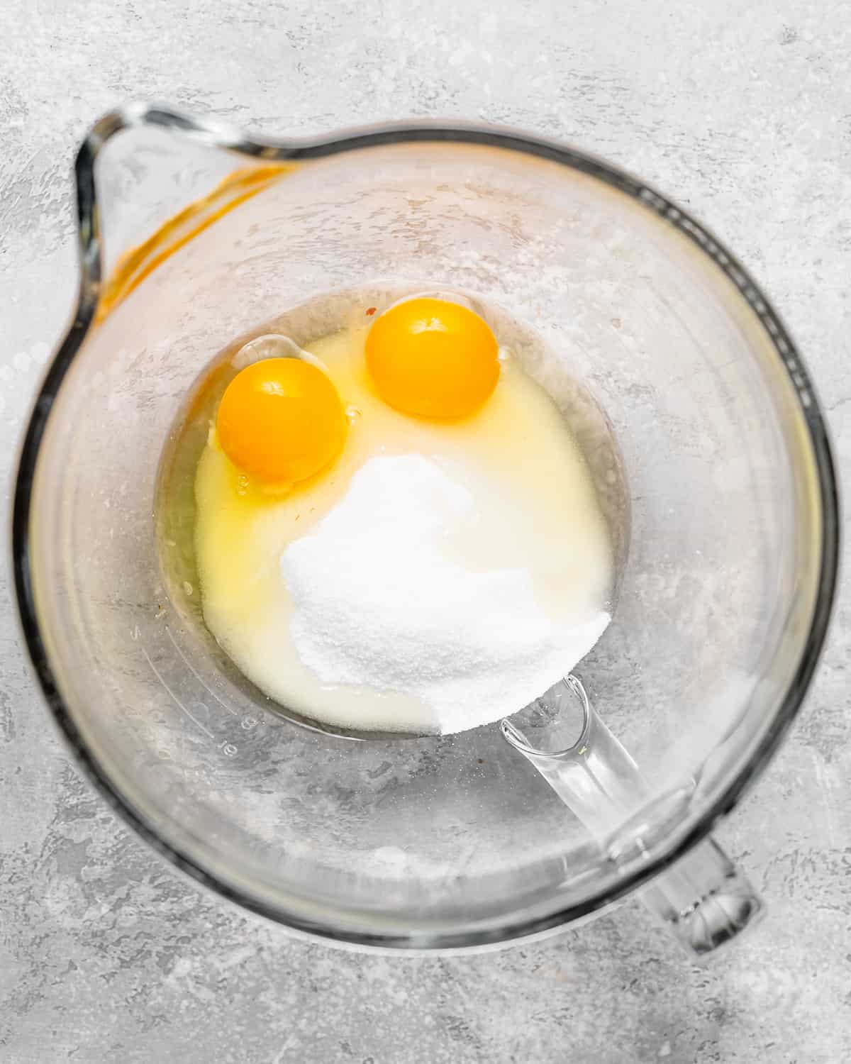 how to make White Chocolate Brownies - eggs and sugar in a bowl before beating