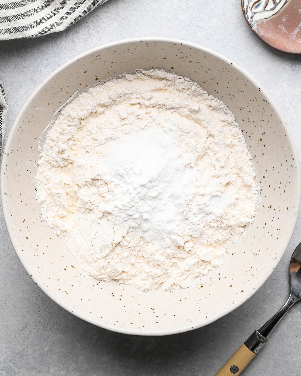 making Lemon Poppy Seed Muffins - dry ingredients in a bowl before mixing