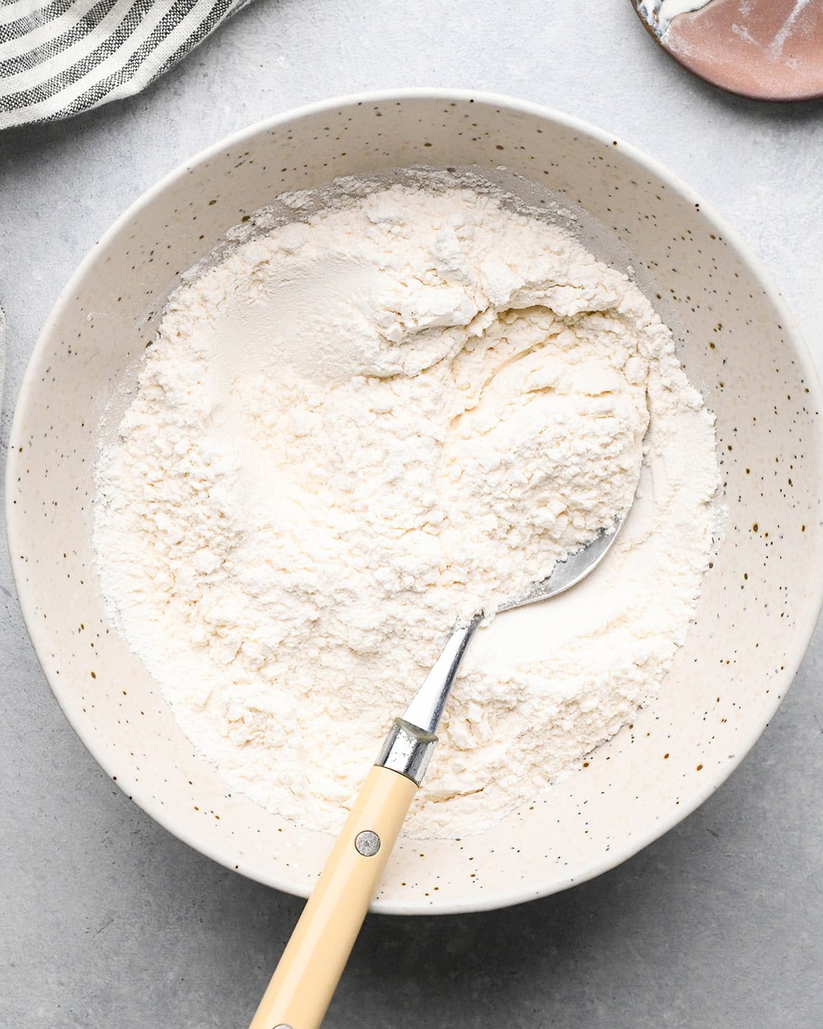 making Lemon Poppy Seed Muffins - dry ingredients combined in a bowl