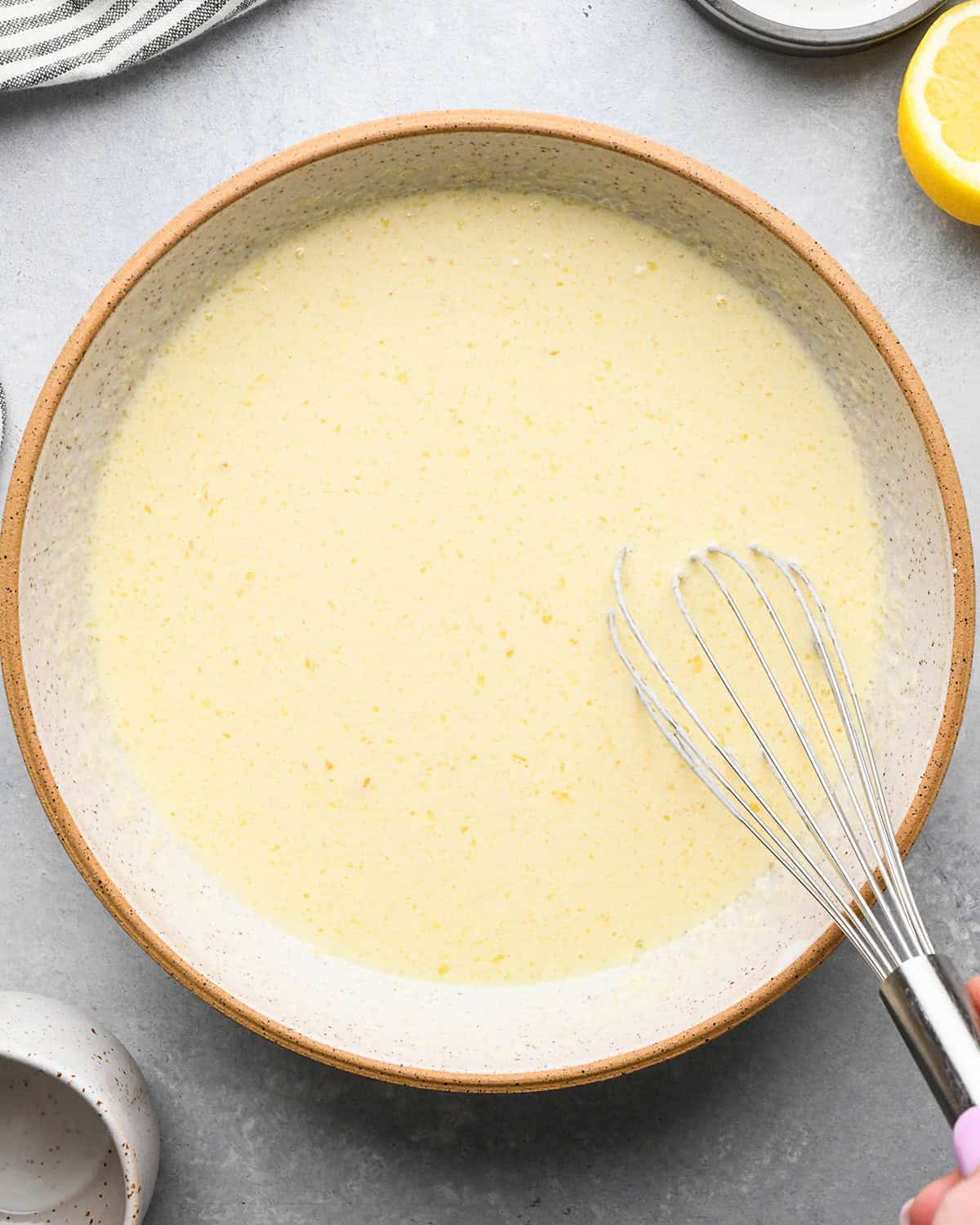 making Lemon Poppy Seed Muffins - wet ingredients after being whisked together in a bowl