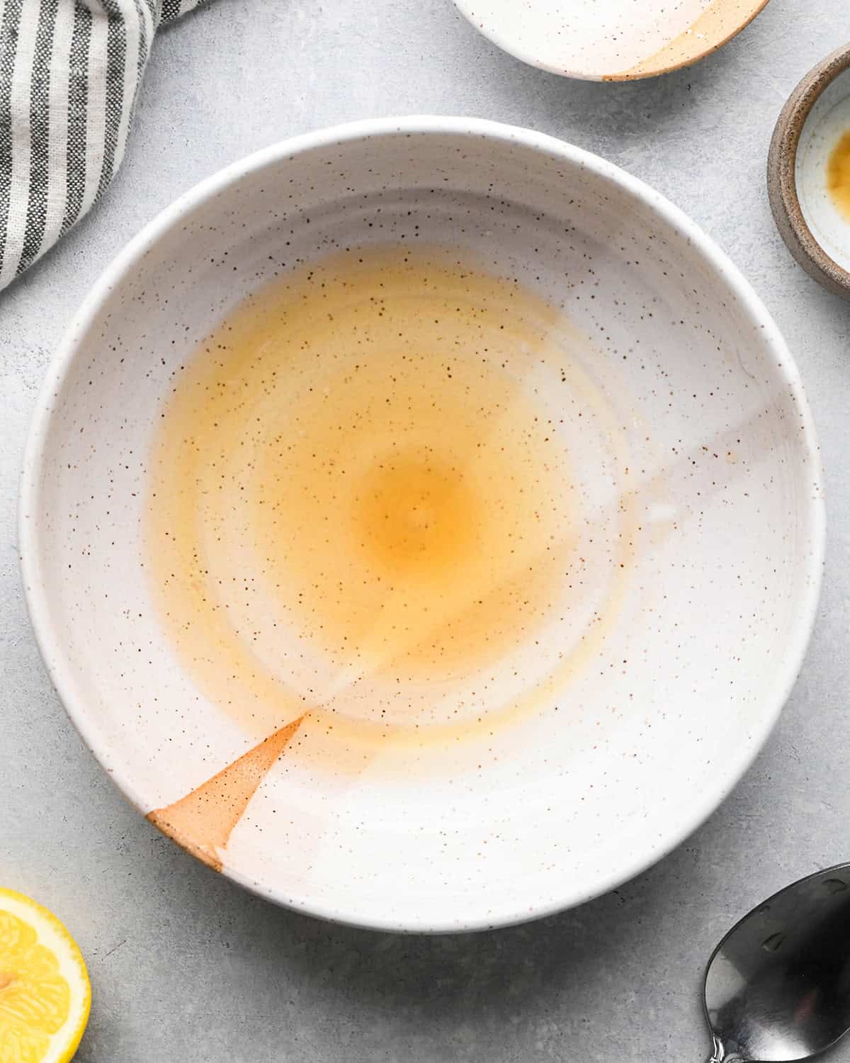 lemon juice and vanilla in a bowl to make Lemon Poppy Seed Muffins glaze