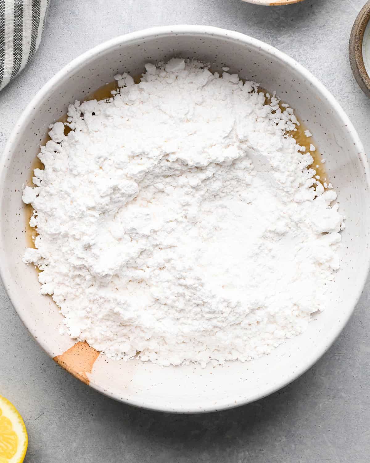 making Lemon Poppy Seed Muffins glaze - adding powdered sugar before whisking