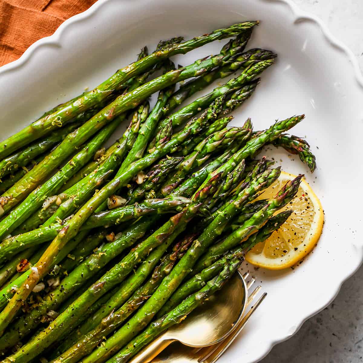 Oven Roasted Asparagus on a white serving dish