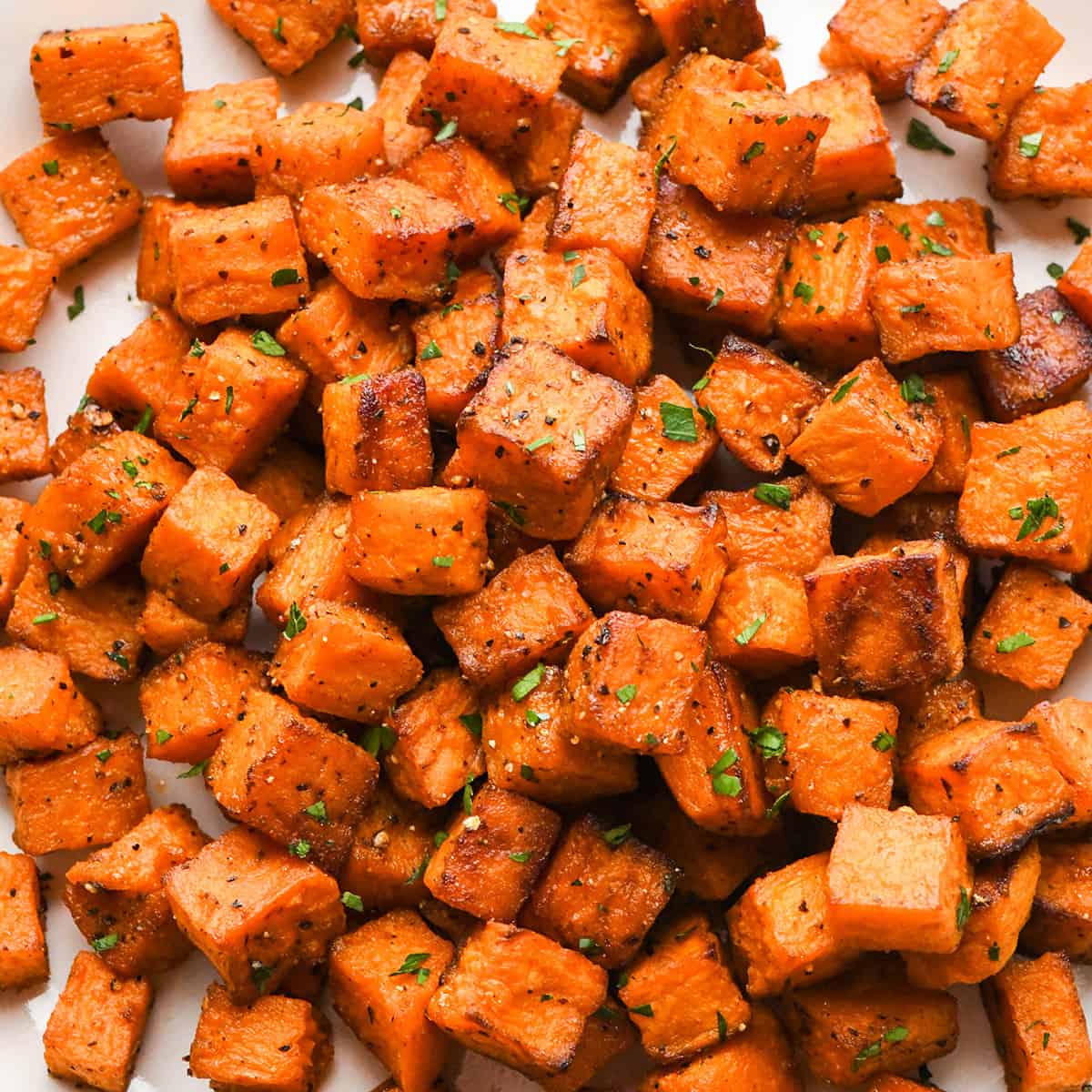 Oven Roasted Sweet Potatoes garnished with parsley