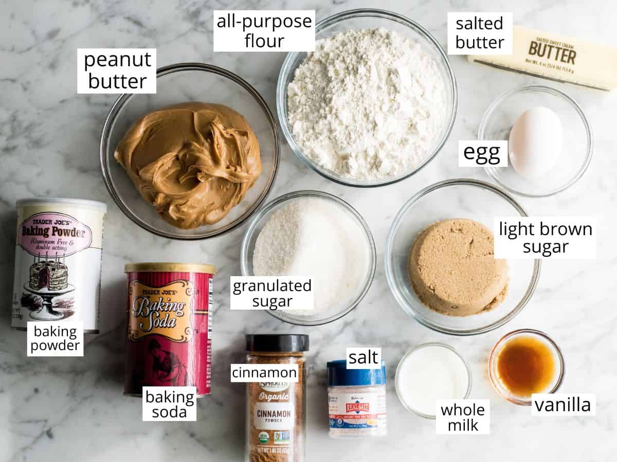 This is the BEST peanut butter cookie recipe ever! These classic, soft peanut butter cookies are easy to make, loaded with peanut butter, and will definitely become your new favorite peanut butter cookie recipe! Learn how to make peanut butter cookies by following our step-by-step instructions and watching the video! #peanutbuttercookies #cookies #peanutbutter #dessert overhead view of the ingredients in this peanut butter cookie recipe