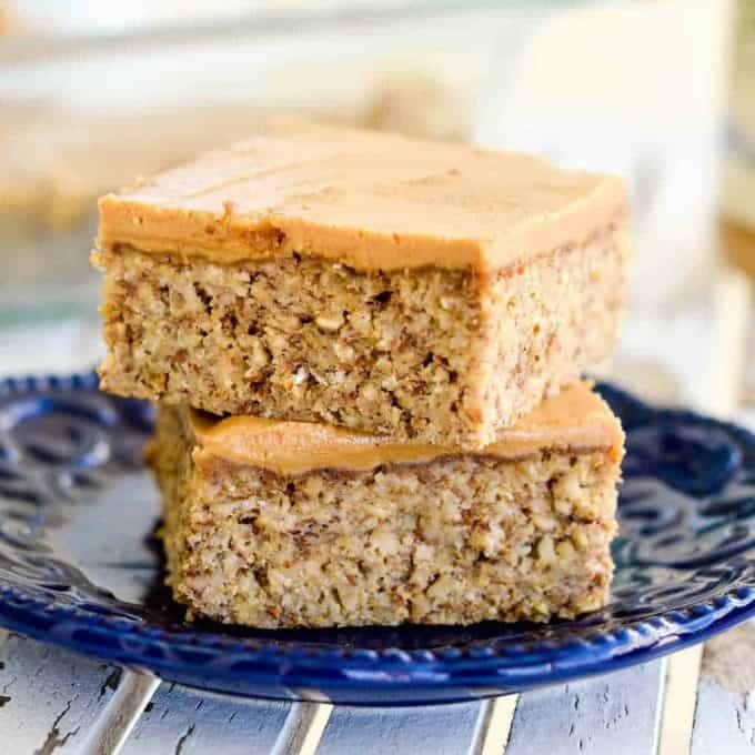These are the BEST Healthy Breakfast Bars ever! I have eaten one every day for over a decade (seriously)! This easy recipe is made in one bowl in 30 minutes, and is loaded with fiber, protein & omega-3s to keep you full all morning long! Plus they’re gluten-free, dairy-free, refined sugar free and vegan! #breakfastbars #oatmeal #peanutbutter #glutenfree #dairyfree #vegan #healthy #refinedsugarfree front view of a stack of two breakfast bars