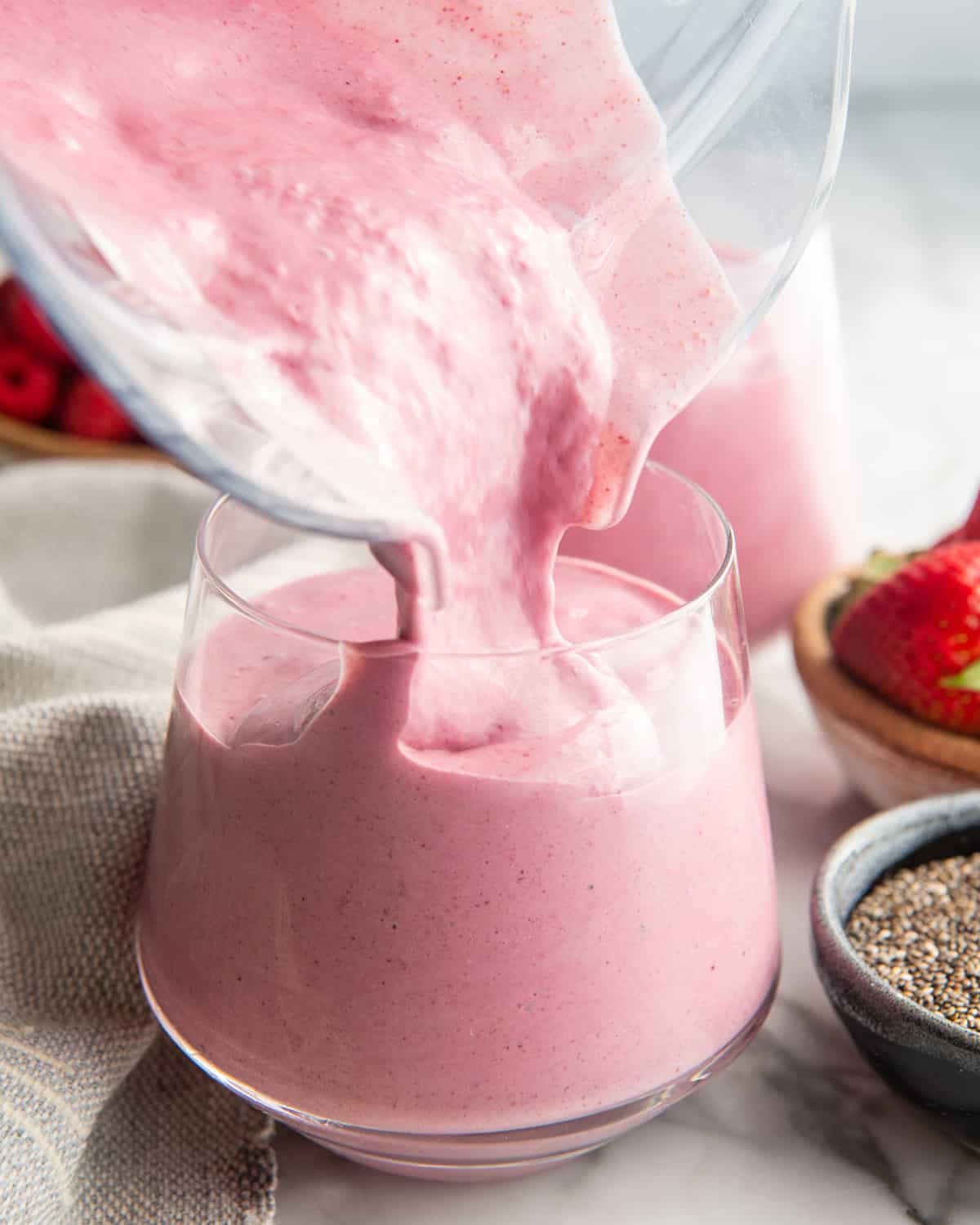 Protein Smoothie being poured from the blending container into a glass