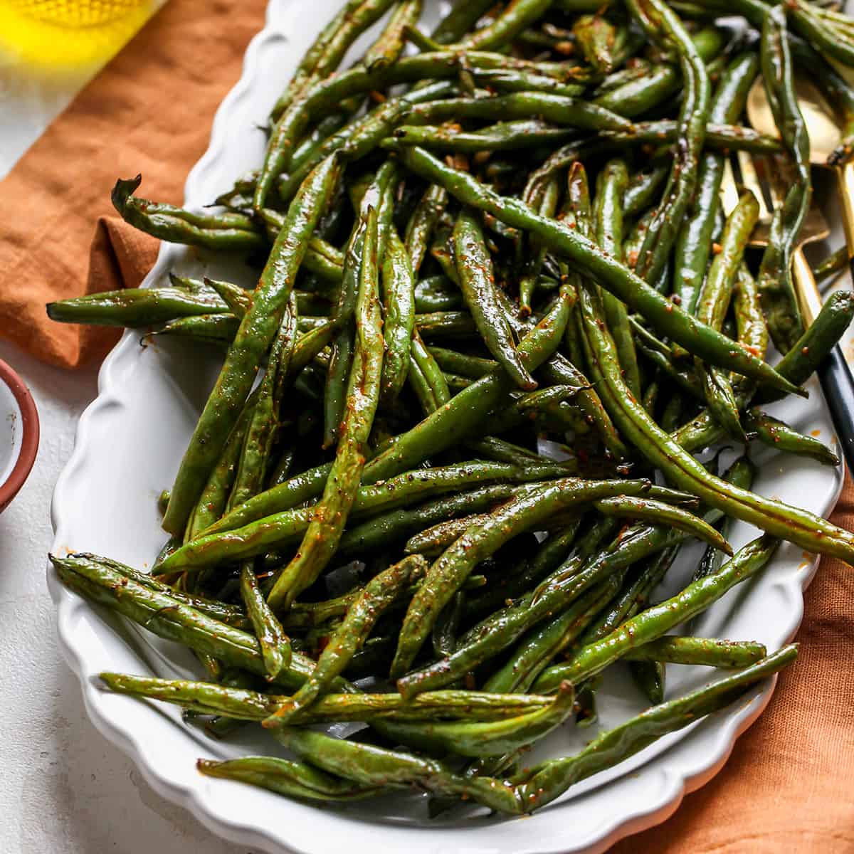 Oven Roasted Green Beans on a white serving dish