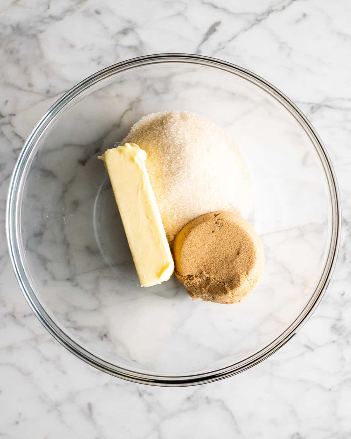 making a Chocolate Chip Skillet Cookie - butter and sugars in a bowl before mixing