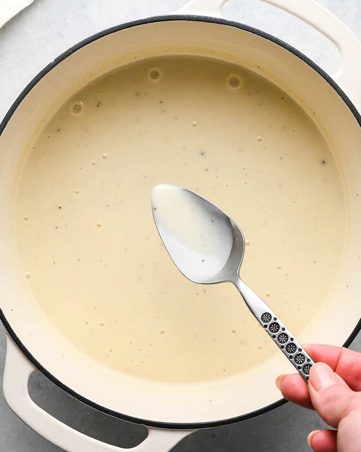 making Chicken Pot Pie Soup - sauce thickened with a spoon