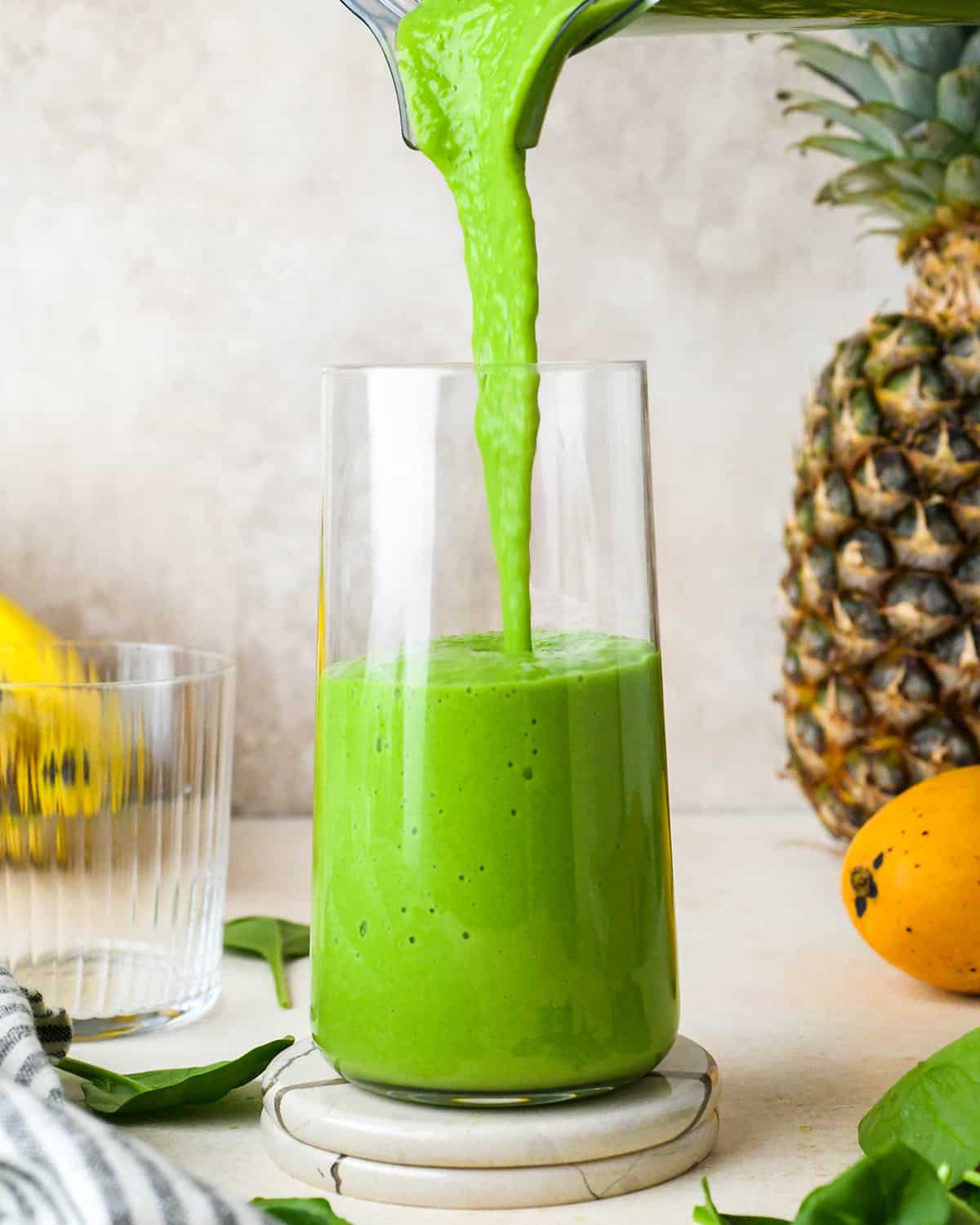Spinach Smoothie being poured into a glass