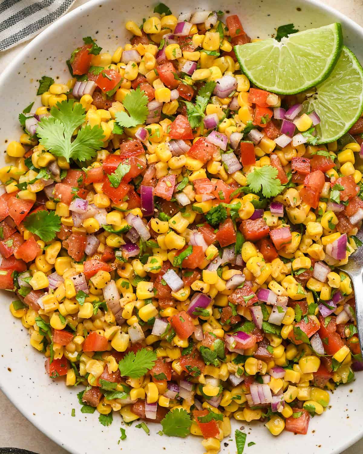 Corn Salsa in a bowl garnished with cilantro