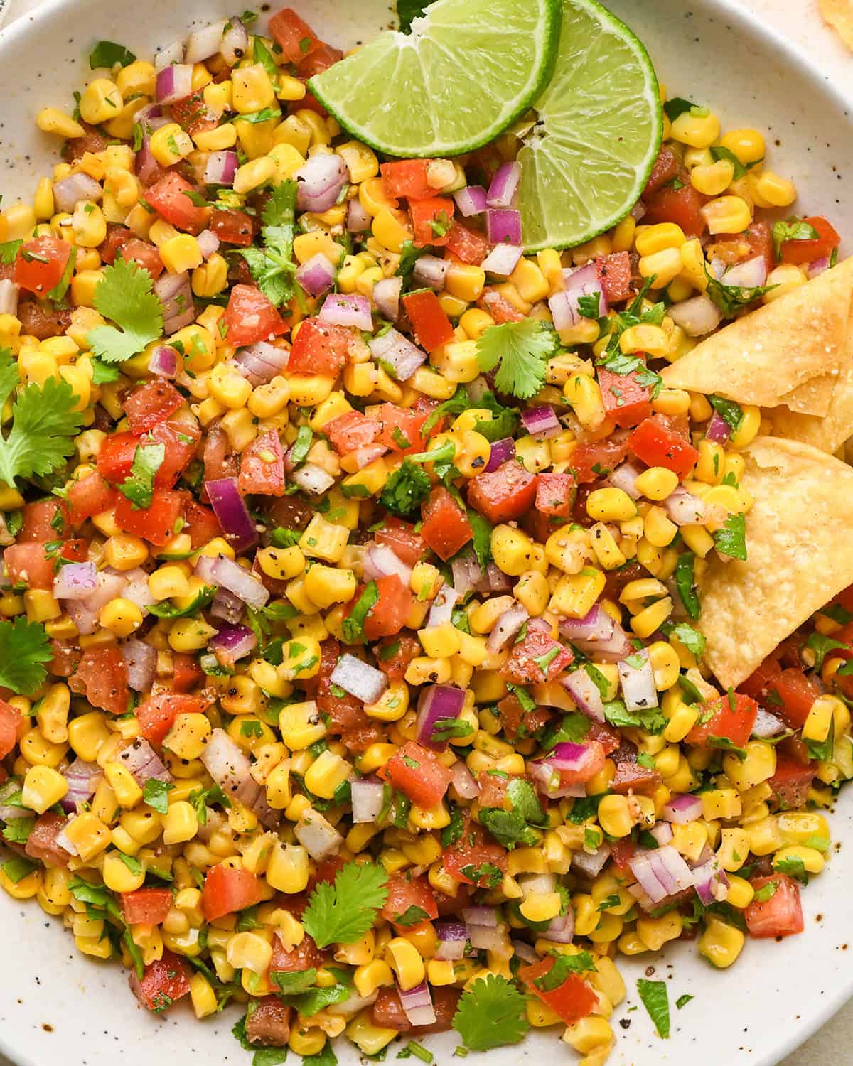 Corn Salsa in a bowl with chips