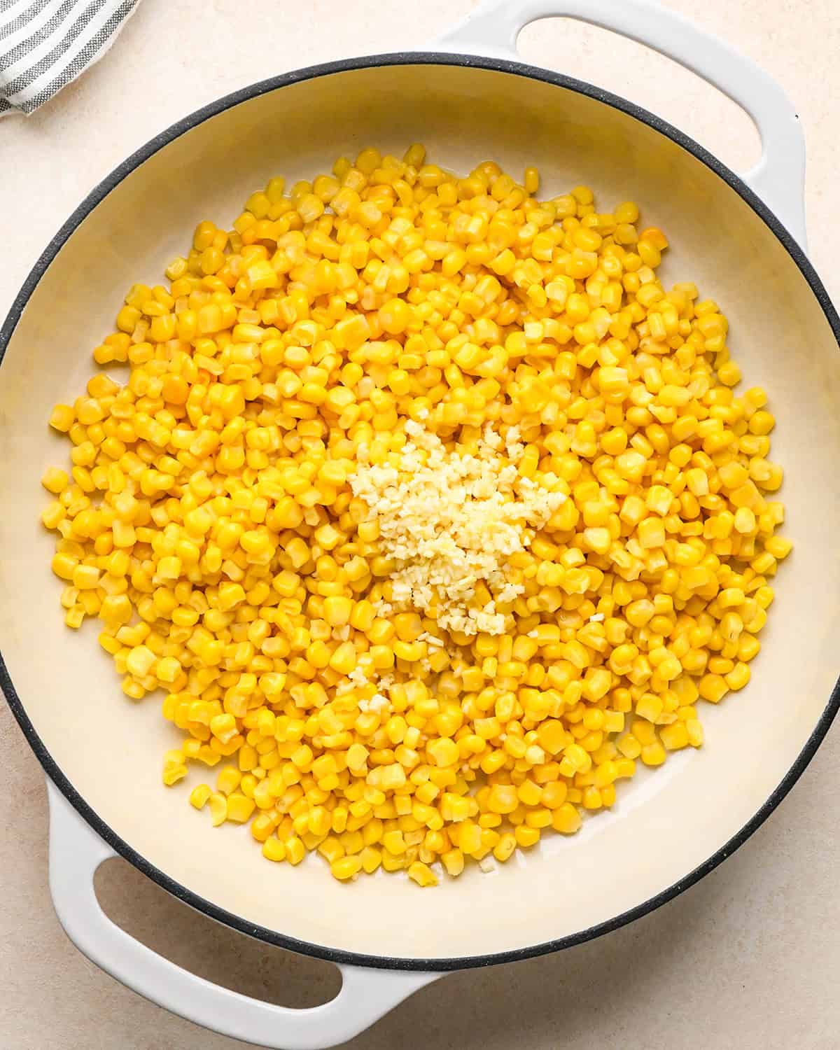 How to Make Corn Salsa - corn and garlic in a pan before cooking